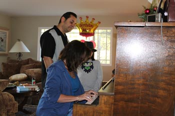 Korvin, Debbie, and Maya practice piano
