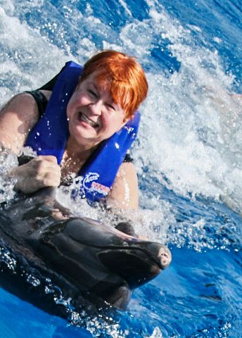 Ellen riding dolphin